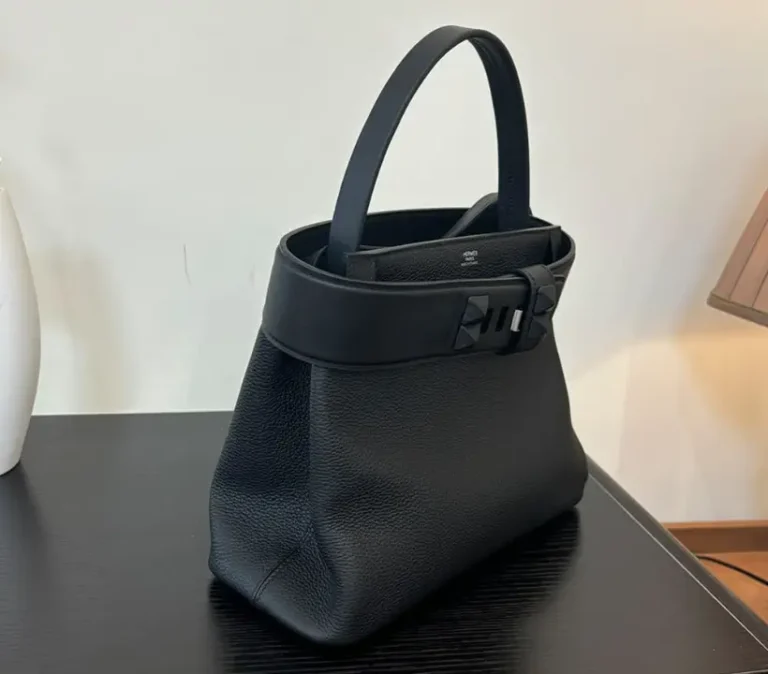 Side view of the Hermès Medor bag