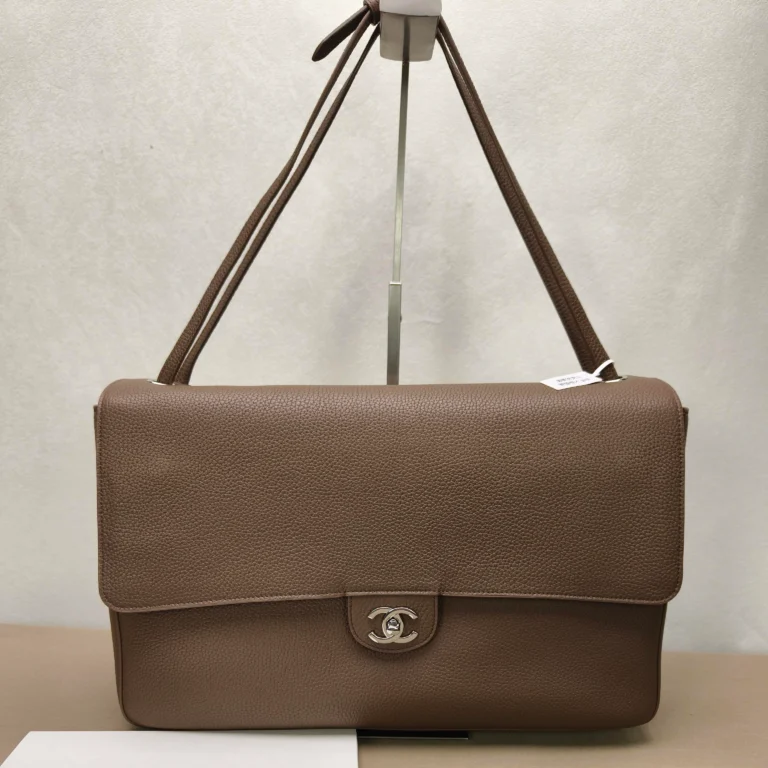 Place the empty bag flat on a table—the high-end replicas feature precisely sized stiffening panels that distribute weight evenly